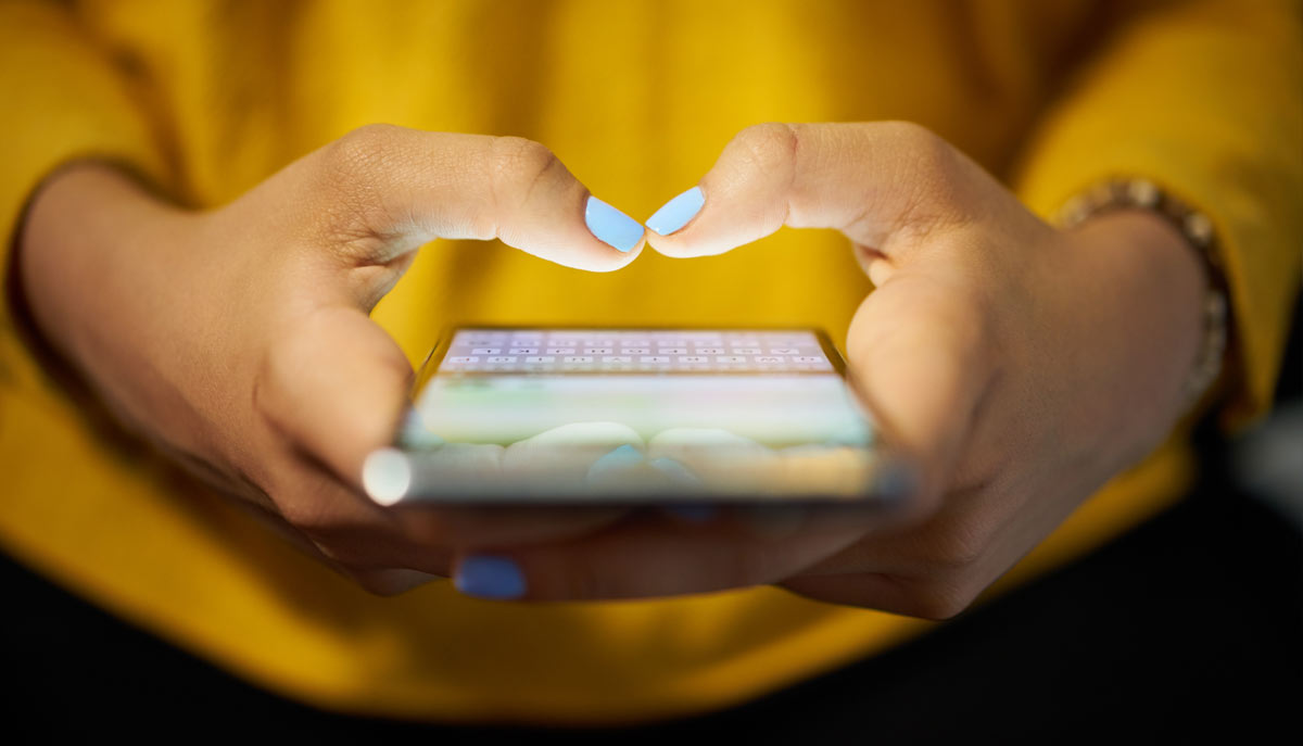 Hand Mobile- Purchasing Management Woman on mobile device dealing with a purchase request management software by Crow Canyon Software